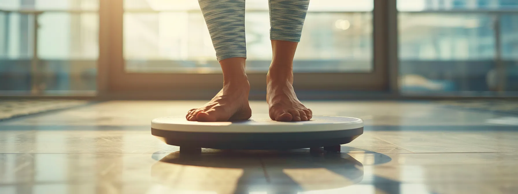 a person stepping on a scale with a determined expression on their face.