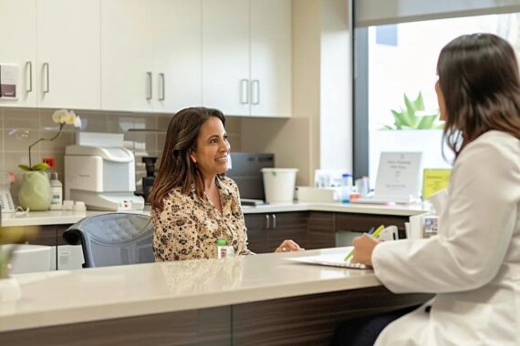 in a modern medical weight loss clinic in california, a compassionate doctor engages a patient in a well-lit consultation room, discussing personalized weight loss plans while showcasing supportive visuals of meal planning and progress tracking, conveying a sense of trust, professionalism, and wellness.